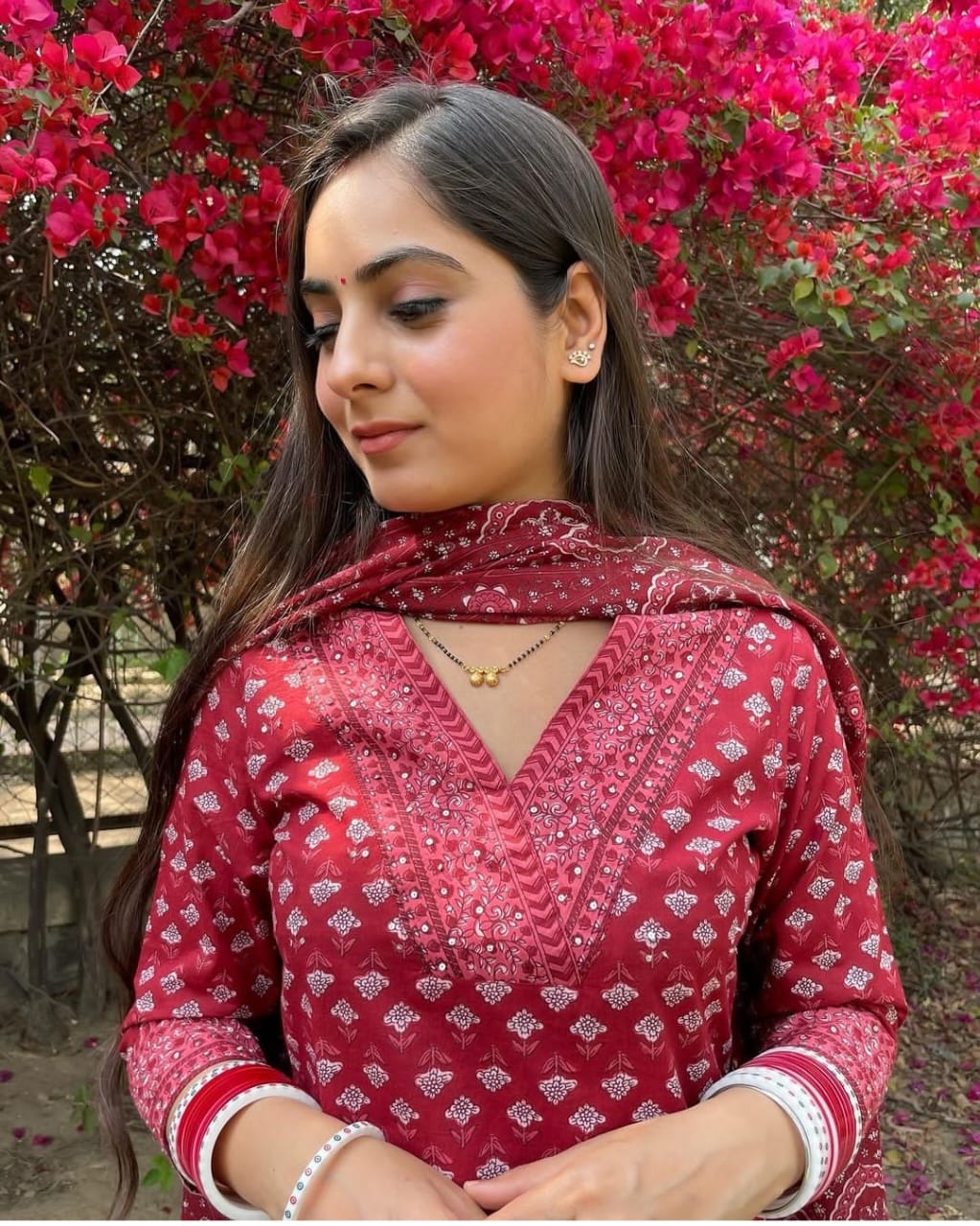 Mustard and red Floral simple suit set which is decorated with finest , and motifs.It is paired with matching Afghani pants and dupatta