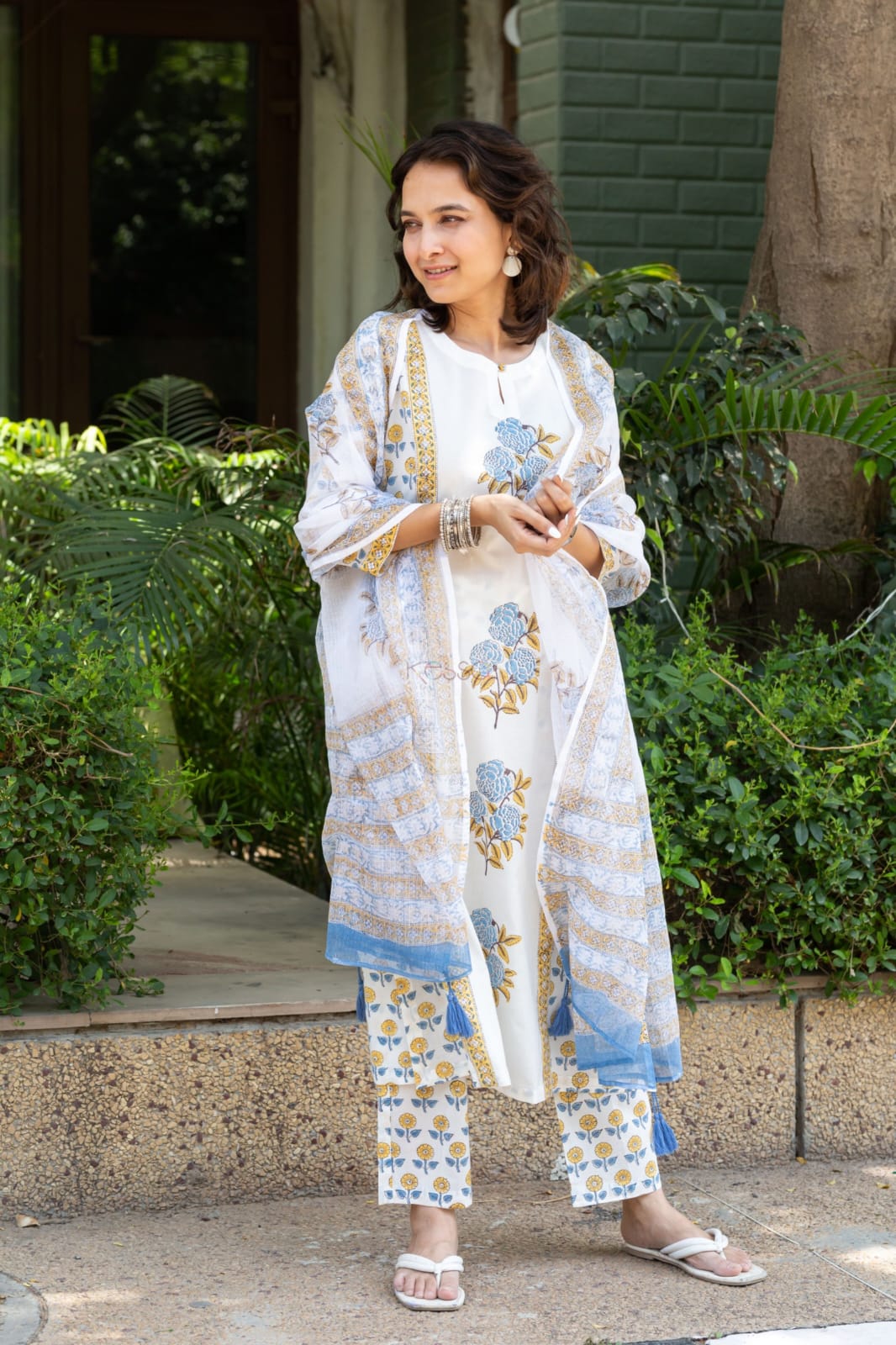 Mustard and red Floral simple suit set which is decorated with finest , and motifs.It is paired with matching Afghani pants and dupatta