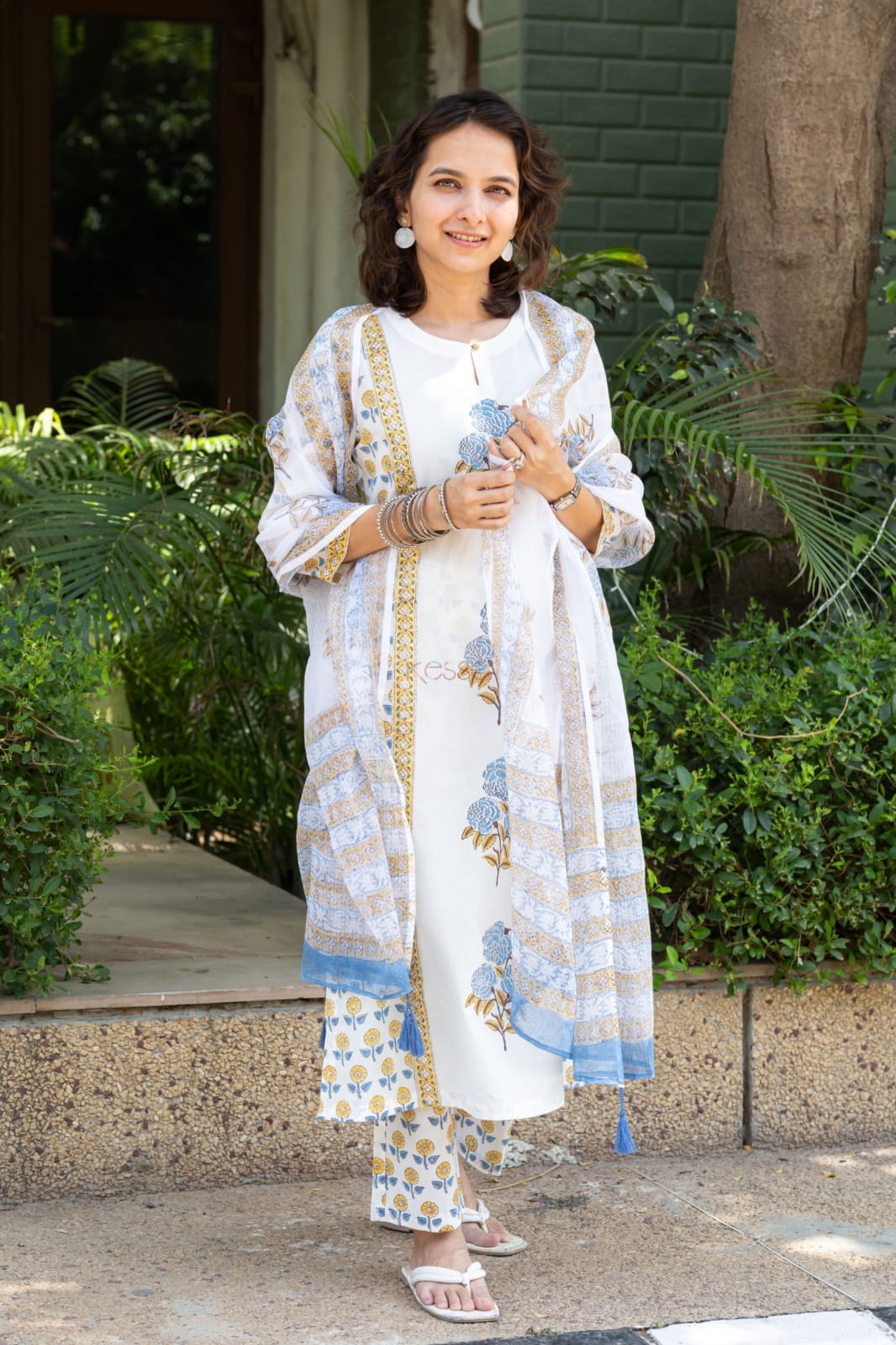 Mustard and red Floral simple suit set which is decorated with finest , and motifs.It is paired with matching Afghani pants and dupatta