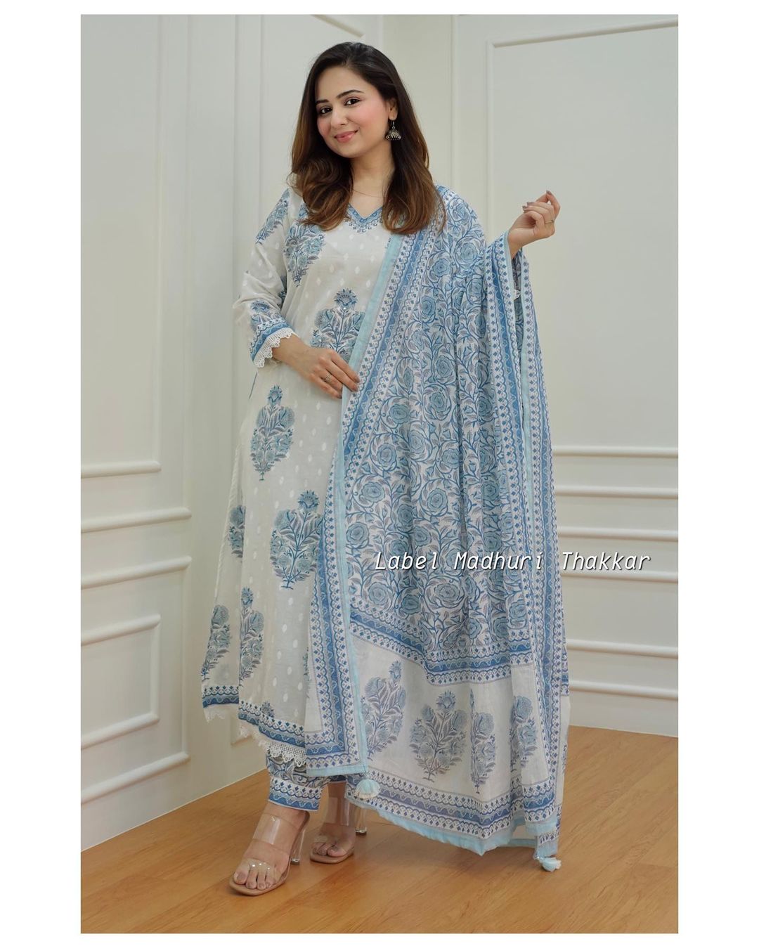 white - grey Floral  suit set which is decorated with finest self print  work  and motifs