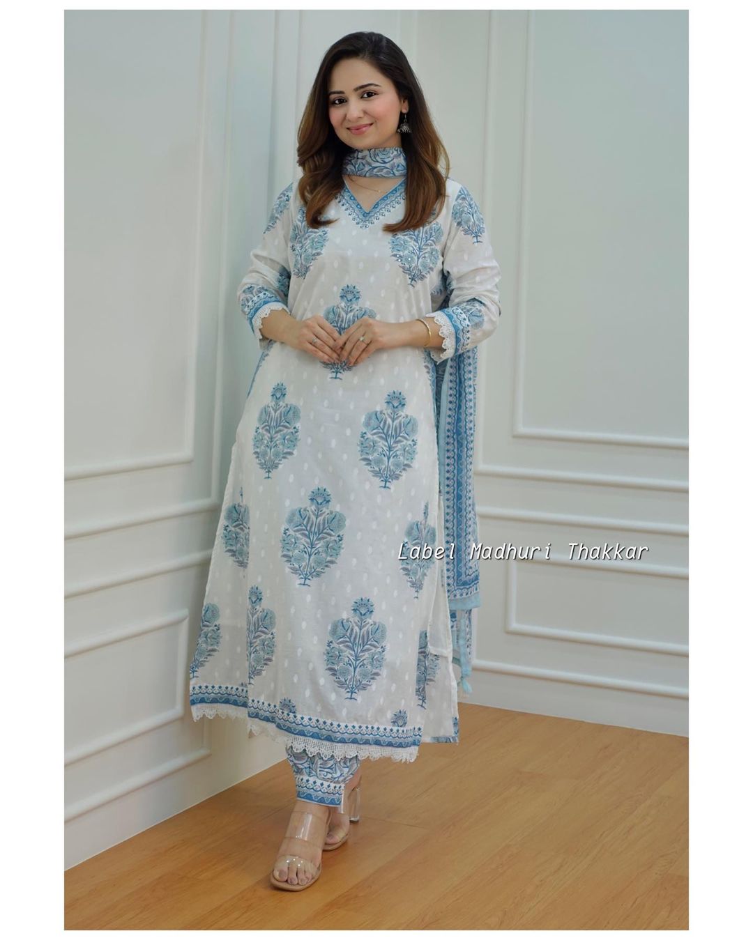 white - grey Floral  suit set which is decorated with finest self print  work  and motifs