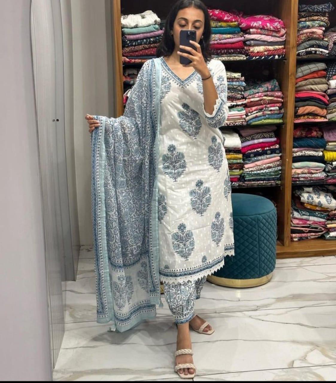 white - grey Floral  suit set which is decorated with finest self print  work  and motifs