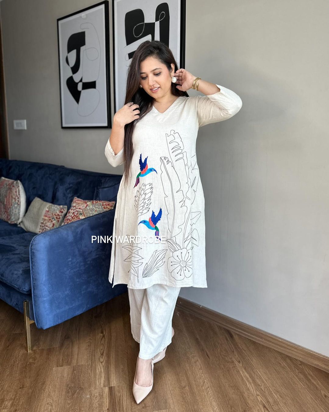Beautiful off-white kurti with intricate thread aari work