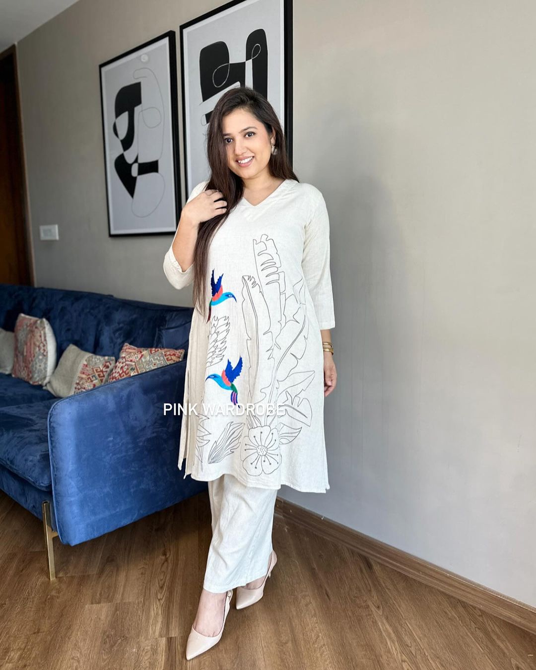 Beautiful off-white kurti with intricate thread aari work