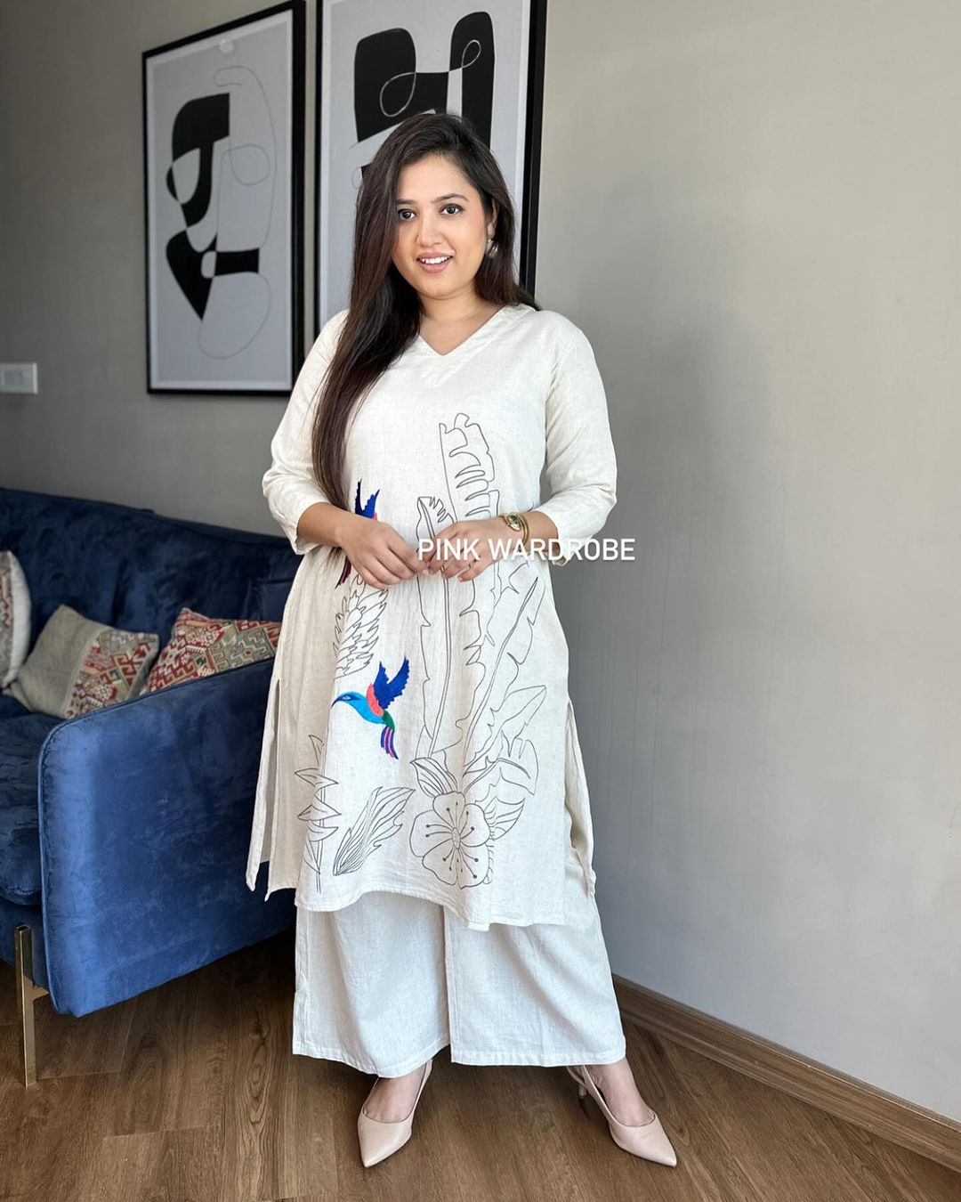 Beautiful off-white kurti with intricate thread aari work